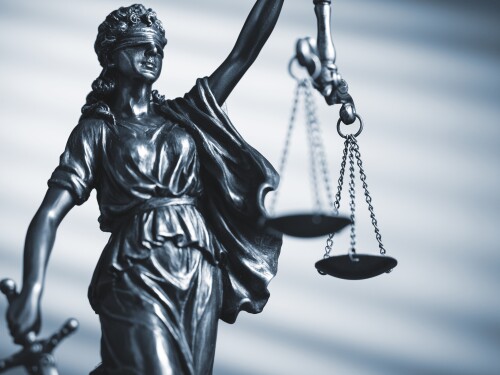 Twenty-three attorneys general have asked for a two-week ban on a federal funding freeze in a draft temporary restraining order filed Thursday morning in U.S. District Court in Providence.