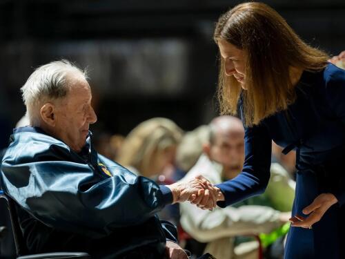Charles Arrigoni shakes hands with Lt Governor Susan Bysiewicz as she passes out medals to Connecticut’s living World War II veterans at the State Armory in Hartford to share their stories and be honored for their service on May 19, 2025.