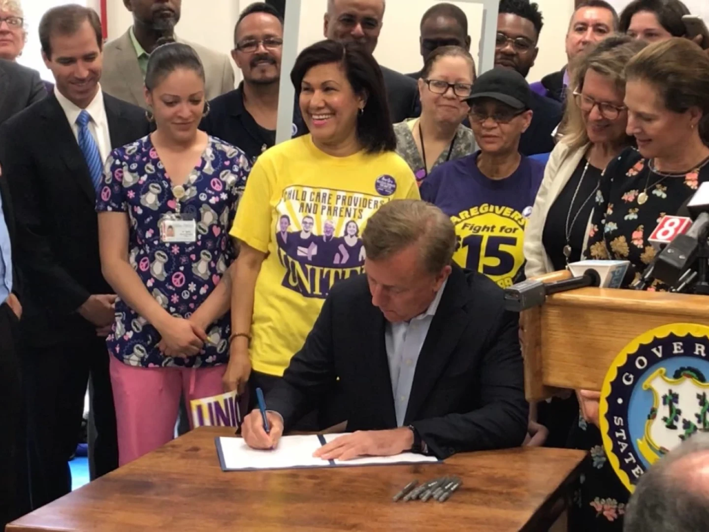 Gov. Ned Lamont signs the legislation gradually increasing Connecticut's minimum wage to $15, with continuing adjustments tied to inflation, May 28, 2019.