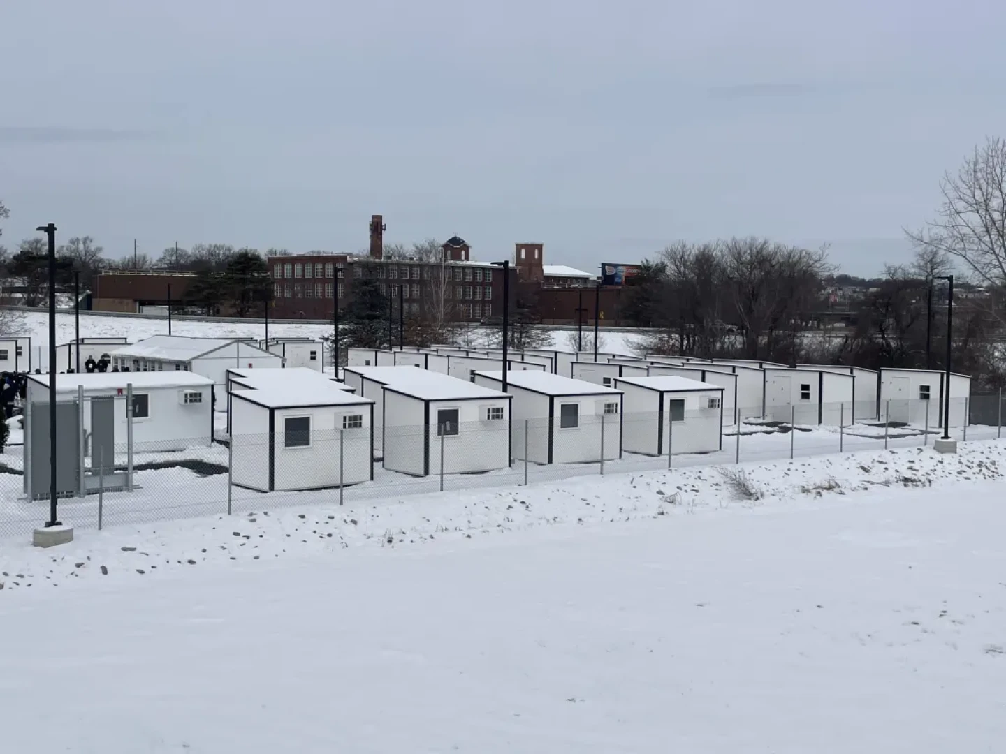 Snow blankets the ECHO Village pallet shelter community in Providence, RI.