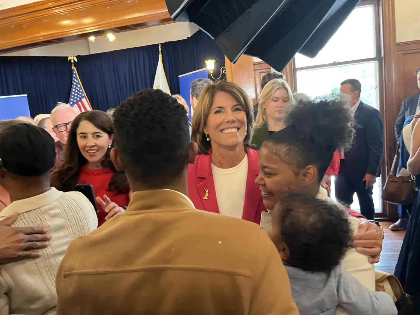 Helena Foulkes greets supporters after her announcement.