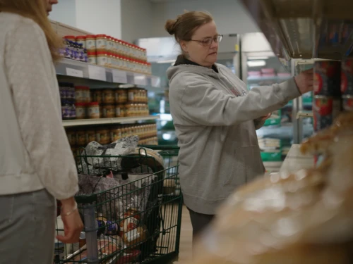 A woman shops at the food bank at the MLK Community Center in Newport.