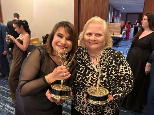 Pamela Watts and Barbara Dury hold Emmy's won for Arts/Entertainment News.