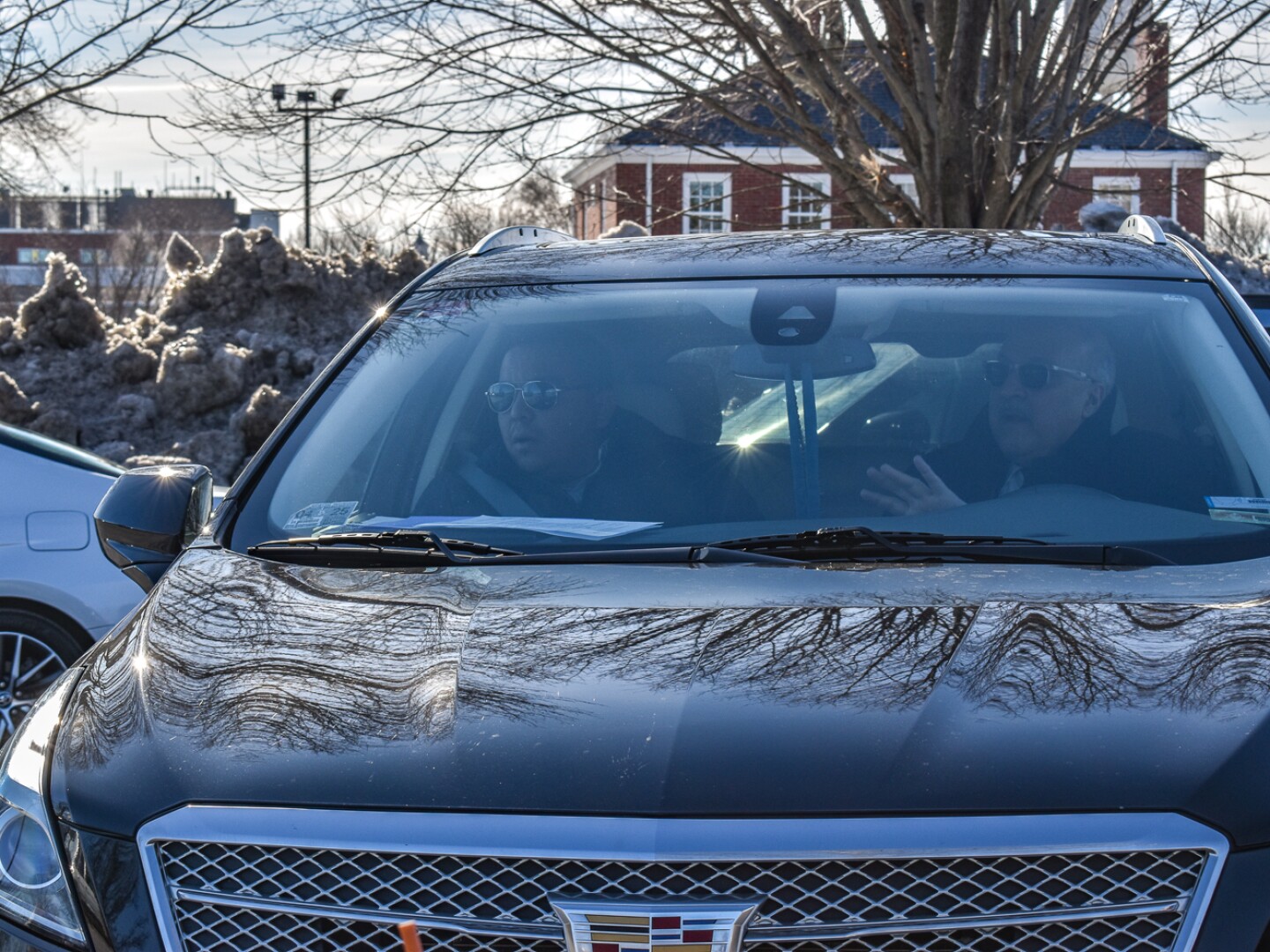 Democratic State Rep. Enrique Sanchez of Providence, left, is seen in the passenger seat of his attorney’s Cadillac following his initial appearance before the Rhode Island Traffic Tribunal on Feb. 19, 2025. Sanchez is being represented by Rep. John Lombardi, a Providence Democrat.