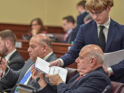 Senate Majority Leader Frank Ciccone III, foreground, receives a packet from a State House page during the Senate Judiciary Committee hearing on Jan. 27, 2026.