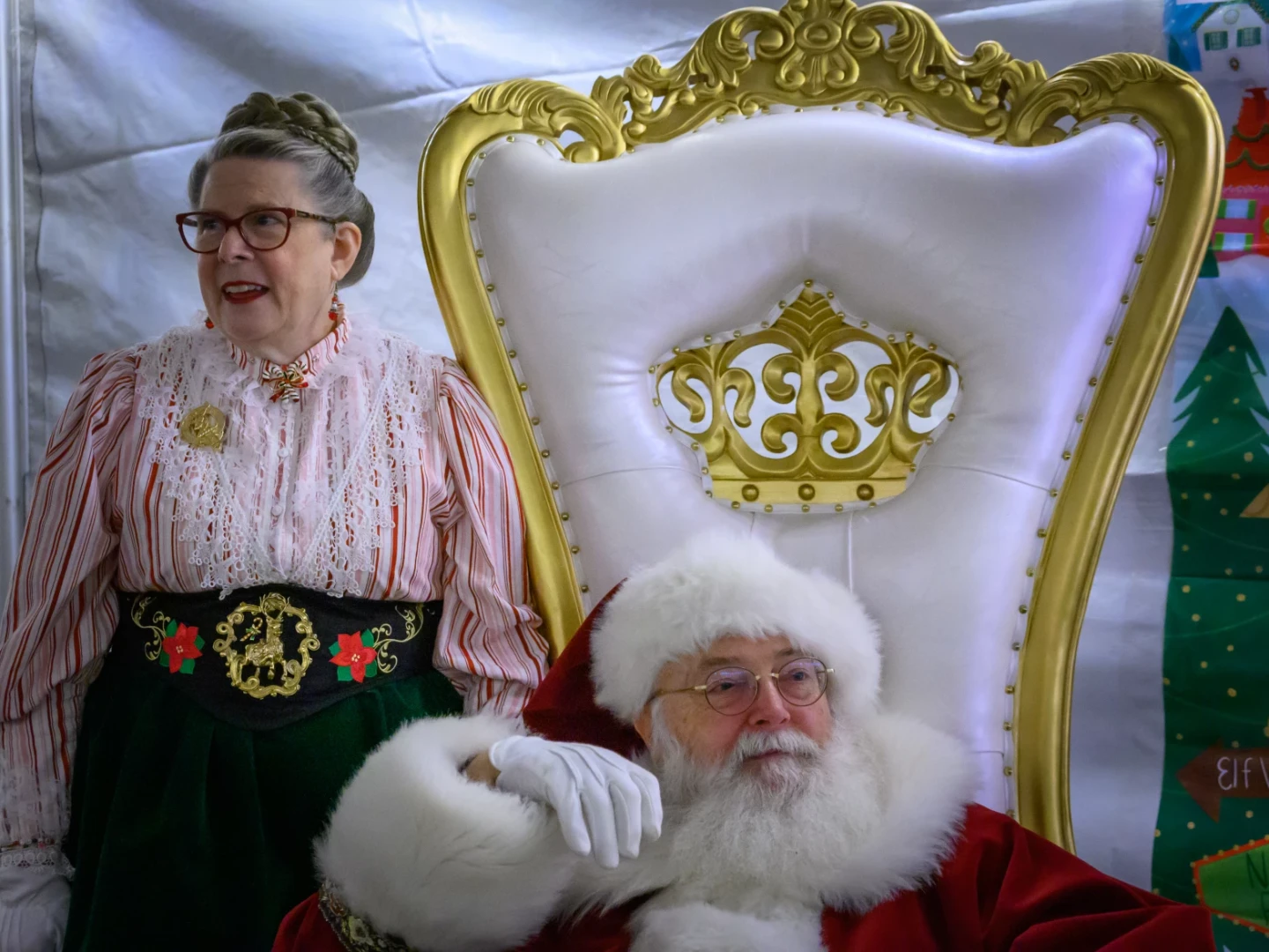 Dave Carrier (above, with his wife Valerie), says he doesn't mind the sore ribs he gets from hugging people during Christmas because he genuinely enjoys lifting people's spirits.