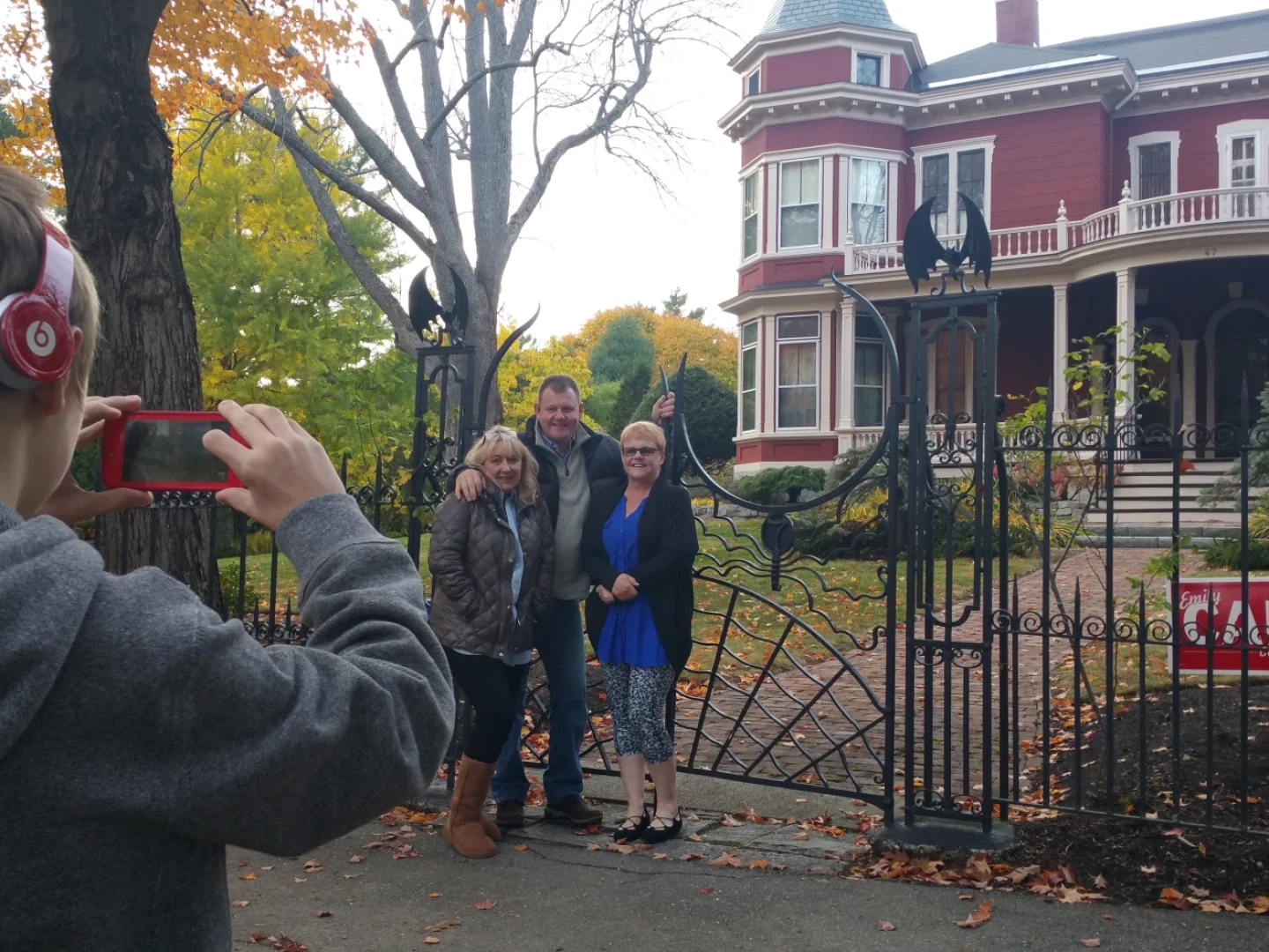 Tourists pose outside Stephen King's Bangor home in 2016.
