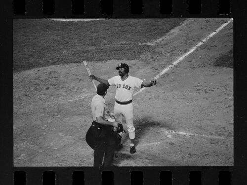 Boston Red Sox player Tommy Harper argues with unknown umpire at home plate, 1973-1975.