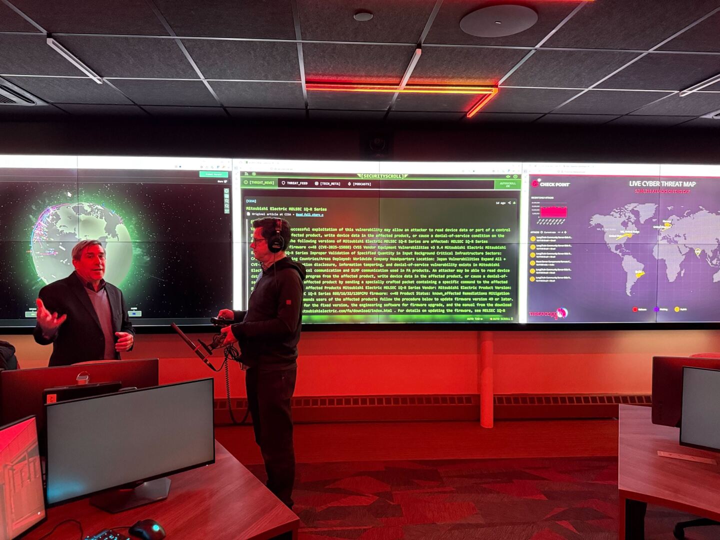 Rhode Island College Computer Science professor Tim Henry speaks with Ocean State Media’s James Baumgartner at the ‘cyber range’ at the Institute for Cybersecurity & Emerging Technologies.
