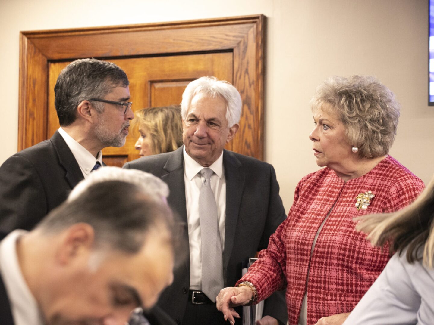 Rhode Island Department of Transportation Director Peter Alviti, Jr., center, is seen with Rep. Patricia Serpa, a West Warwick Democrat, right, on Thursday, Feb. 13, 2025, before a joint oversight hearing by both Rhode Island senators and representatives. Lawmakers had plenty of questions for Alviti about the Washington Bridge.