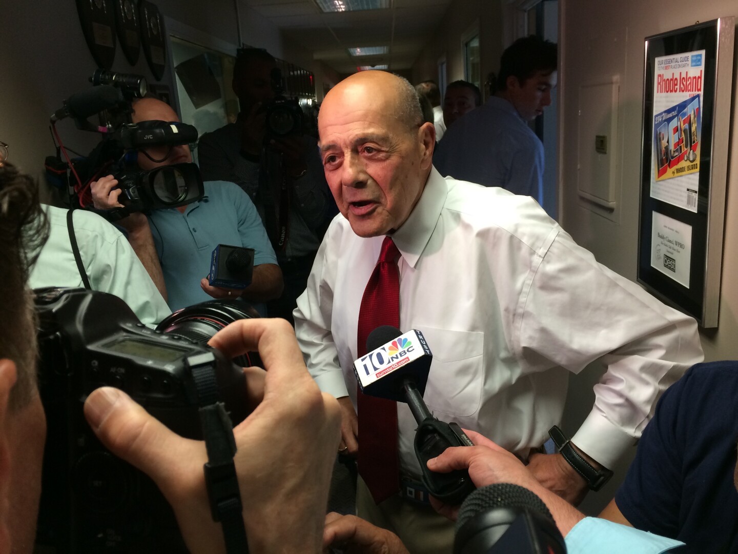File: Buddy Cianci faces reporters after announcing his second comeback attempt, in 2014.
