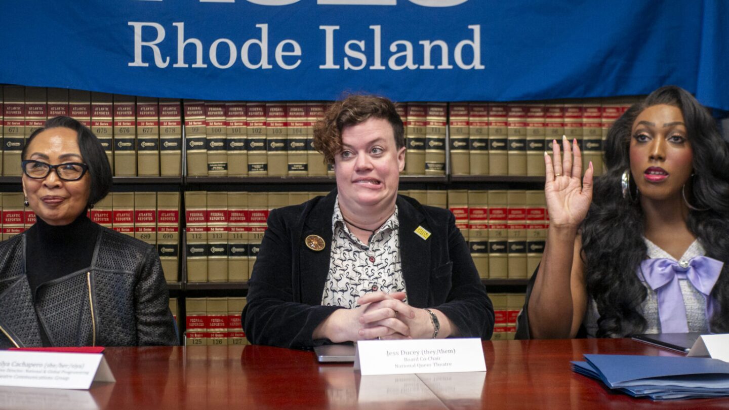 Left to right, Emilya Cachapero of Theatre Communications Group, Jess Ducey of National Queer Theater, and Giselle Byrd of The Theater Offensive react to a question at a March 6, 2025, press conference about challenges facing queer and LGBTQ+ performing arts groups under new federal grant requirements. All three are plaintiffs in a suit against the National Endowment for the Arts filed with the help of the Rhode Island chapter of the American Civil Liberties Union. The fourth plaintiff is Rhode Island Latino Arts.