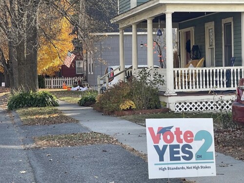 A sign supporting Question 2 is displayed on a lawn on Mechanic Street in Shelburne Falls, Massachusetts.
