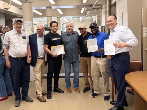 League Of Rhode Island Businesses-backed Santos Javier (second from right), joined by Rep. Ramon Perez and Senate Majority Leader Frank Ciccone (center)