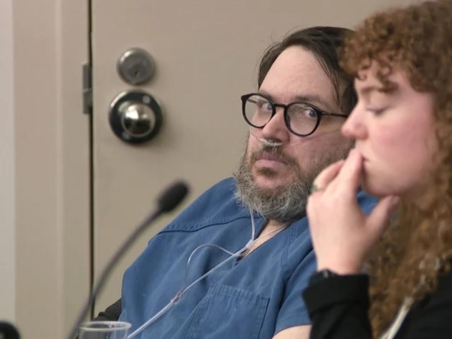 In this image captured from video, Nicholas Rossi, left, appears in a Salt Lake City court, Monday, Oct. 20, 2025, for his sentencing hearing on a rape conviction. To his right is MacKenzie Potter of the Salt Lake Legal Defender Association.