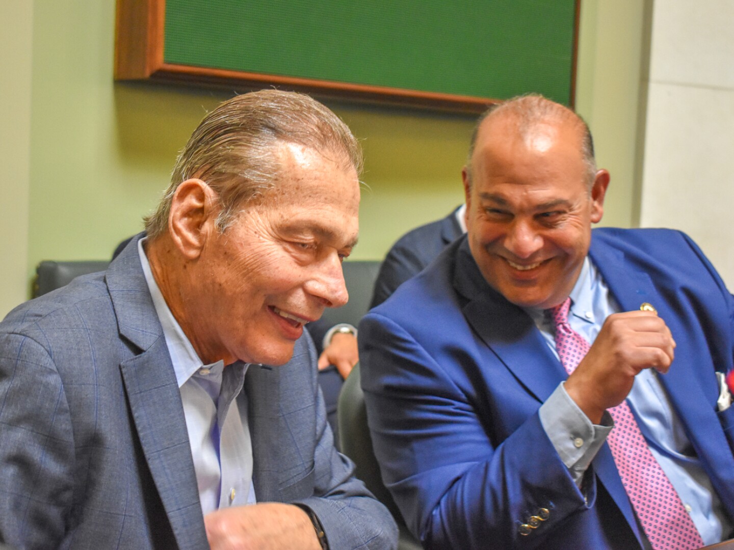 Senate President Dominick Ruggerio, left, shares a laugh with Sen. David Tikoian during his return to the Senate floor June 6, 2024.