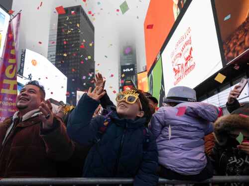 People watch confetti test ahead of New Year's Eve celebration in Times Square, Monday, Dec. 29, 2025, in New York.