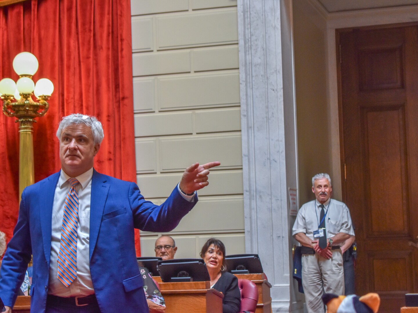 Rep. Jason Knight, a Barrington Democrat, defends his bill to ban assault-style weapons during debate on the House floor on June 5, 2025.