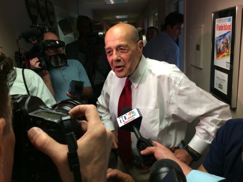 File: Buddy Cianci faces reporters after announcing his second comeback attempt, in 2014.