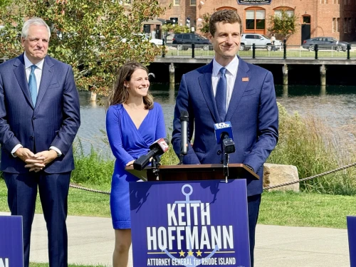 Hoffmann, right, with his wife, Rachel, and Attorney General Peter Neronha.