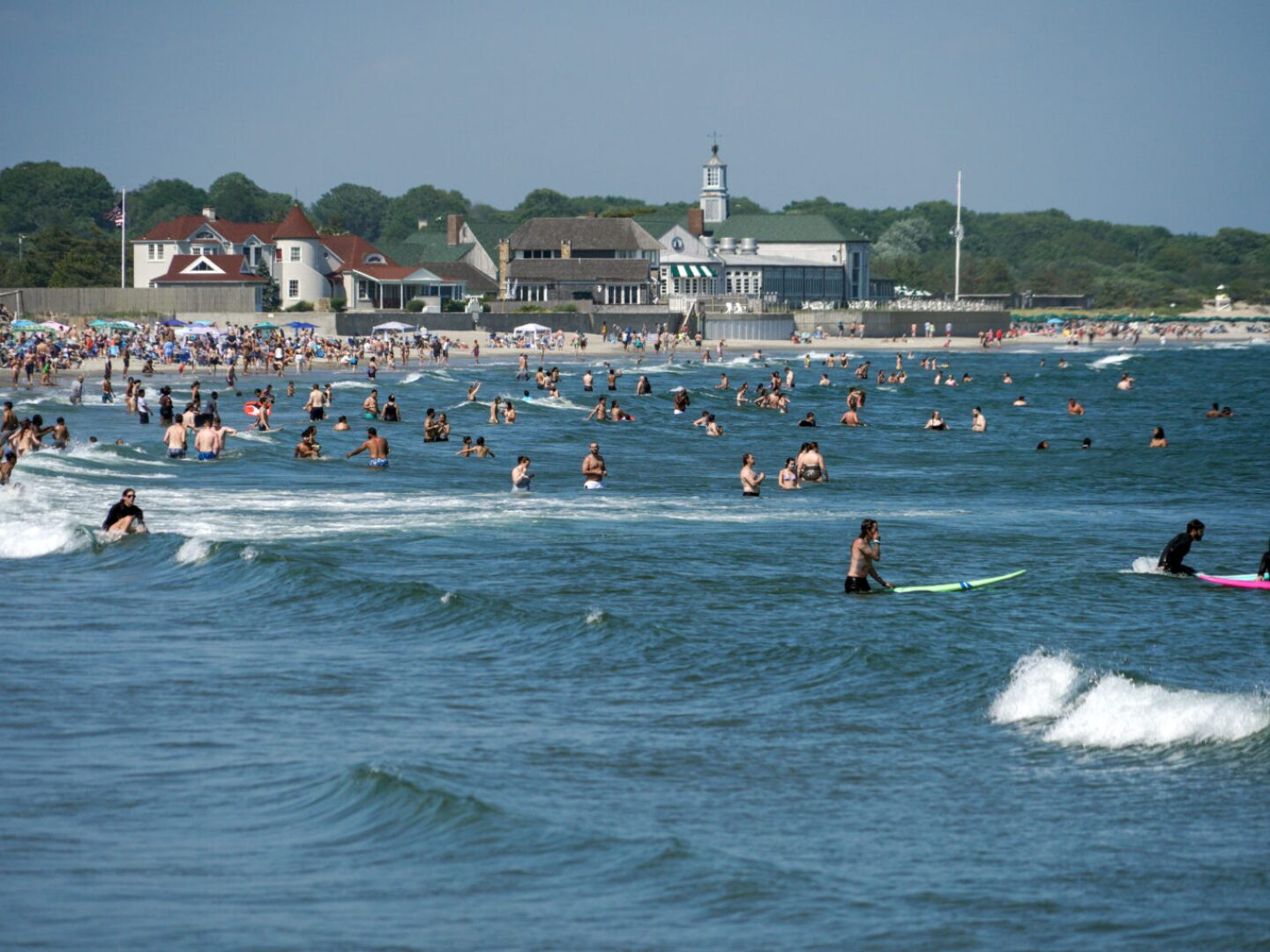 Beachgoers are shown at Narragansett Town Beach on June 22, 2025, during the recent period of very hot weather.