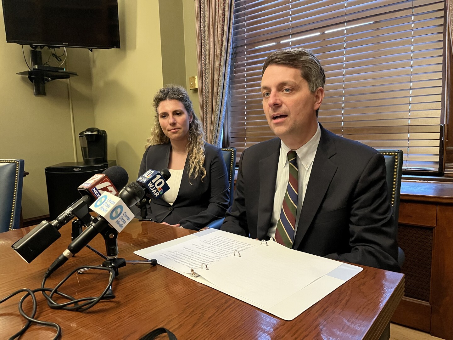 House Speaker Chris Blazejewski speaks with reporters in his Statehouse office after backing the creation of a Rhode Island office of inspector general, a proposal aimed at boosting government accountability and restoring public trust.