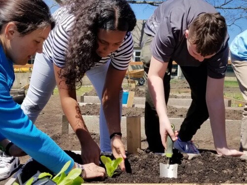 Katharine Bowers, left, was named 2024 Teacher of the Year by the Rhode Island Environmental Association. She helped establish a composting and food waste reduction program at the middle school where she teaches.