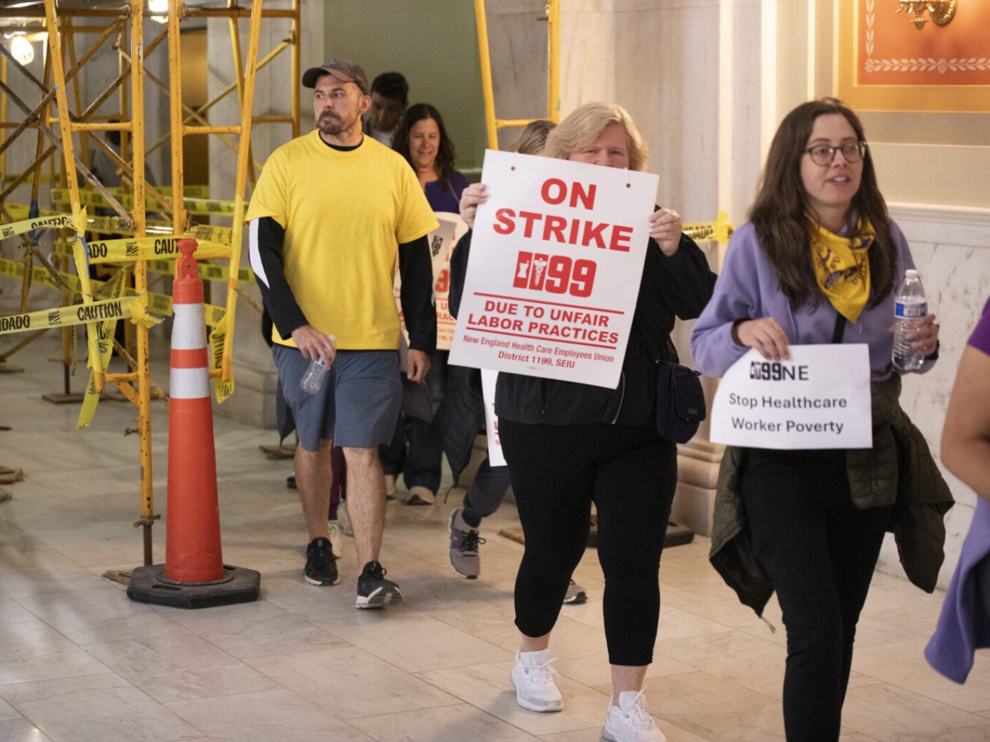 Striking Butler Hospital workers are seen on the third floor of the Rhode Island State House on May 20, 2025.