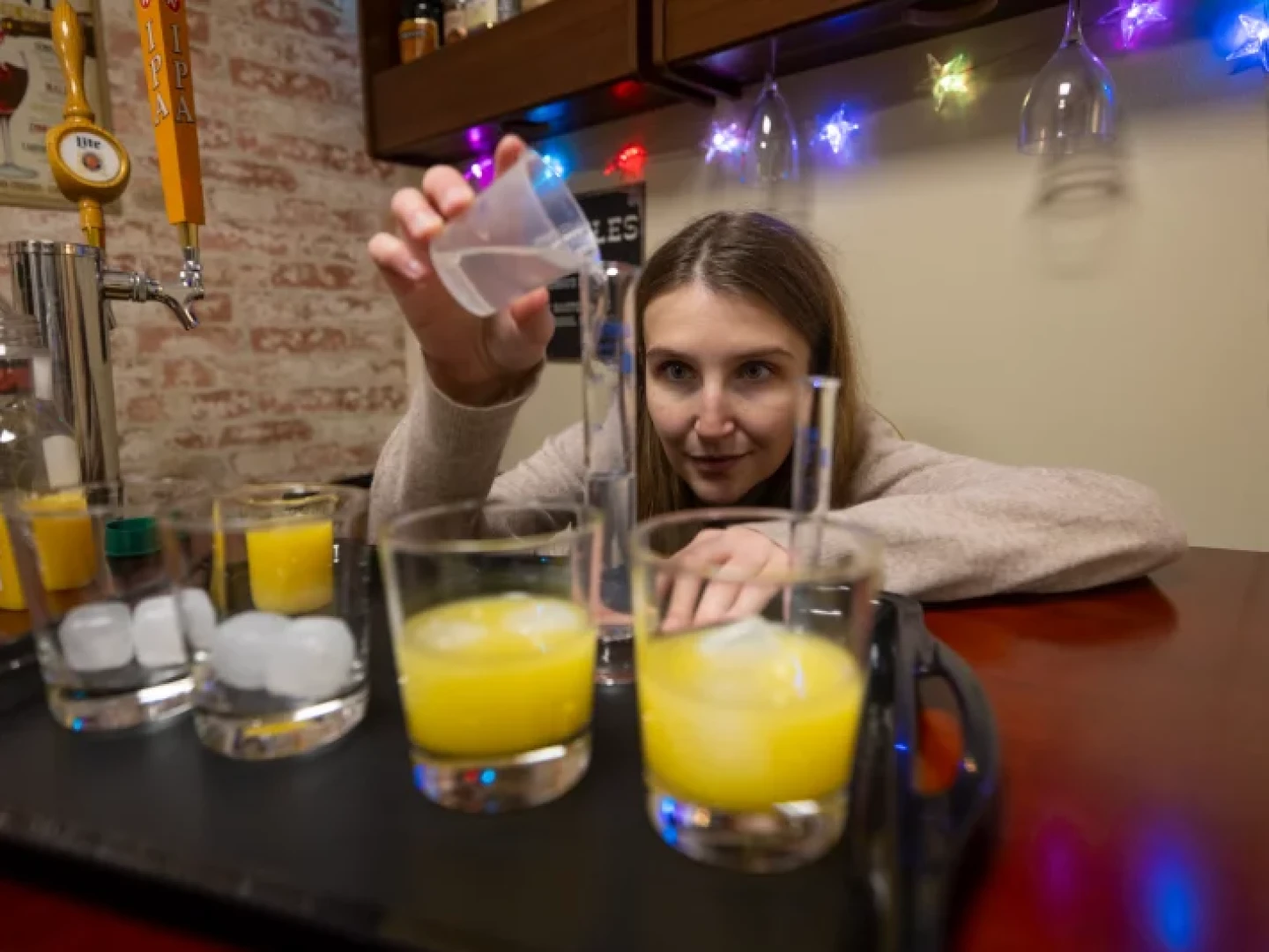 Hayley Buckey, who works in Jane Metrik's lab at Brown University, measures alcohol in the Bar Lab.